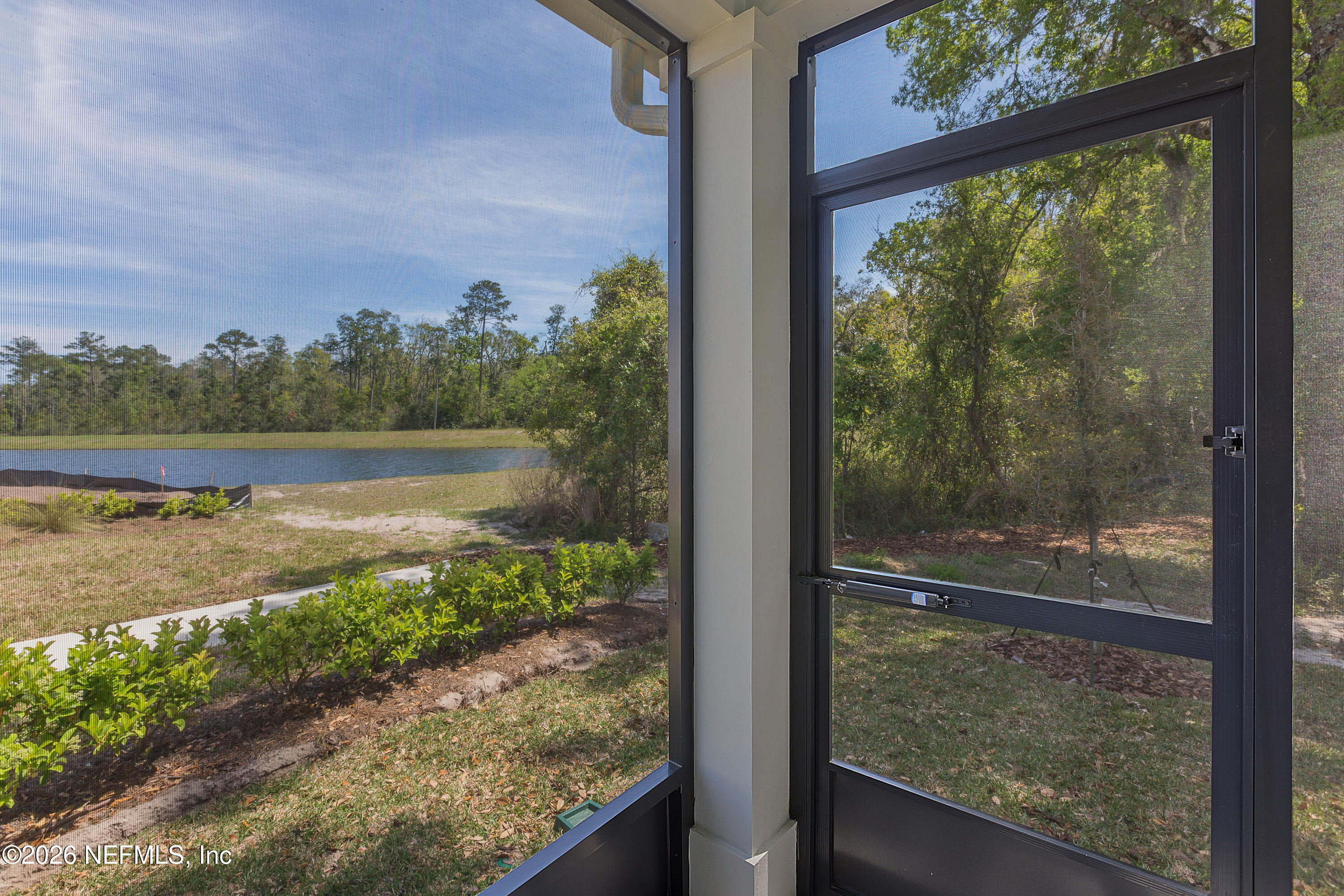 4963 Shell Crk Trail Jacksonville, FL 32226 - Photo 25 of 39 a view of a glass door with a yard from a window