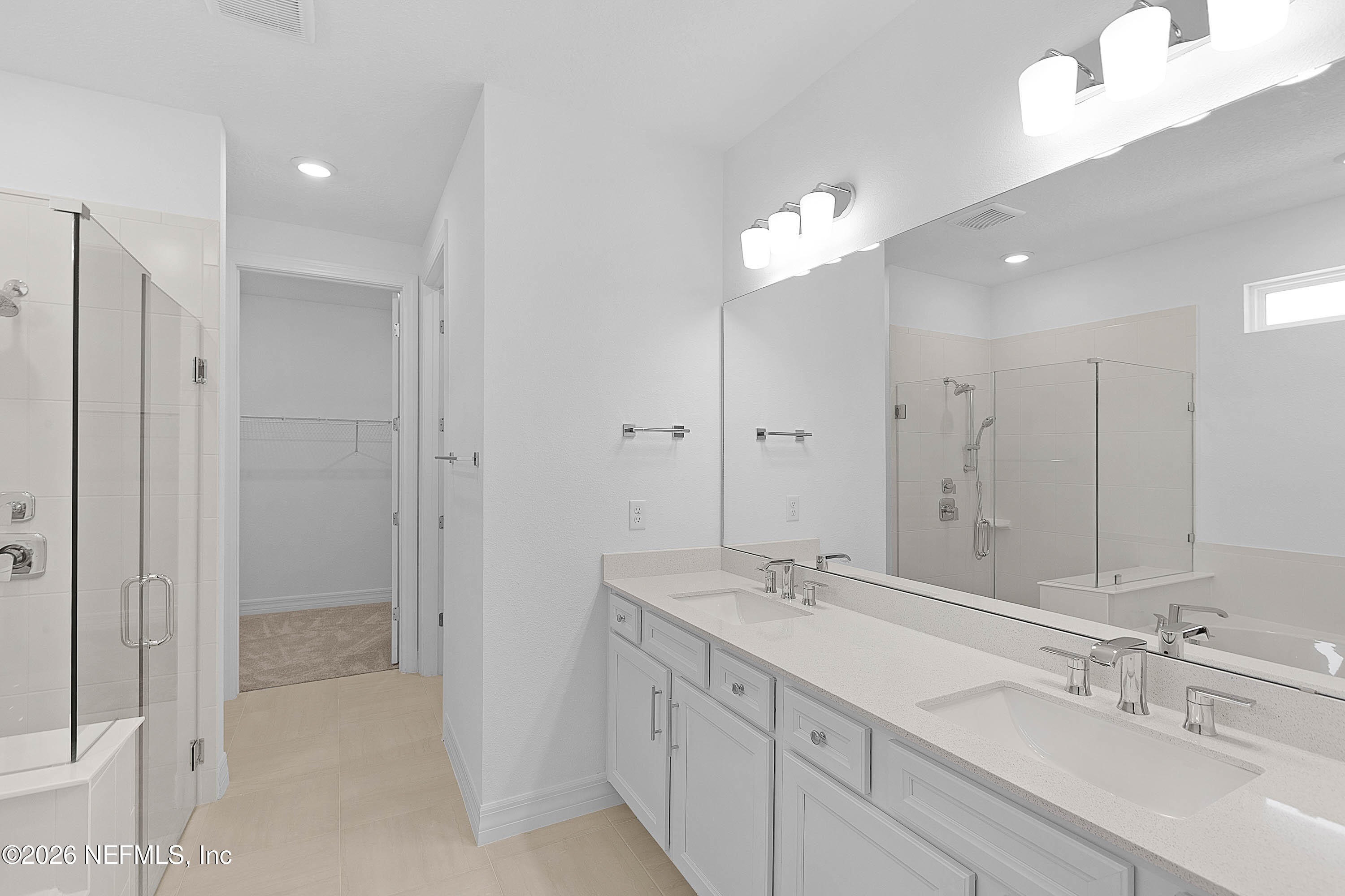 4963 Shell Crk Trail Jacksonville, FL 32226 - Photo 9 of 39 a bathroom with double vanity sinks and a shower