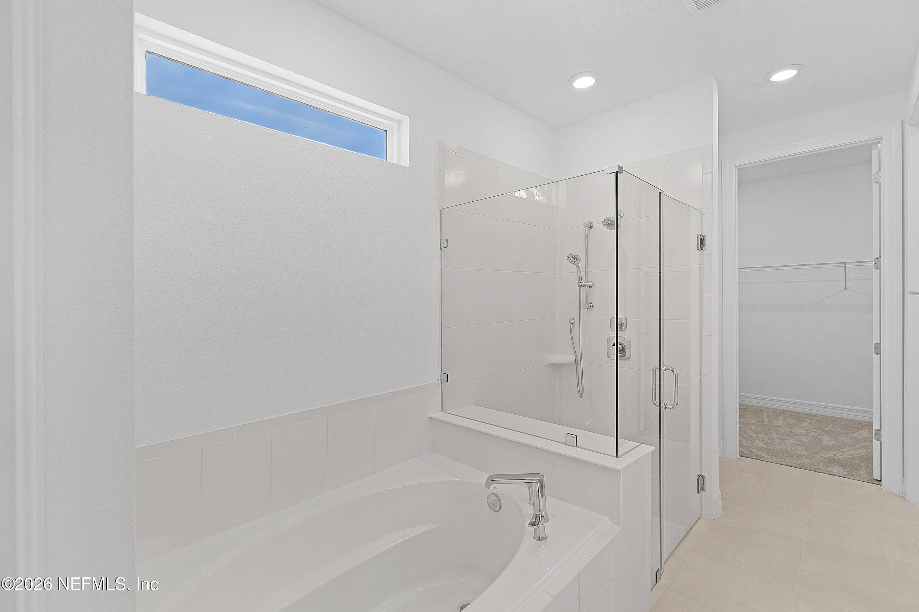 4963 Shell Crk Trail Jacksonville, FL 32226 - Photo 10 of 39 a bathroom with a bathtub and a shower