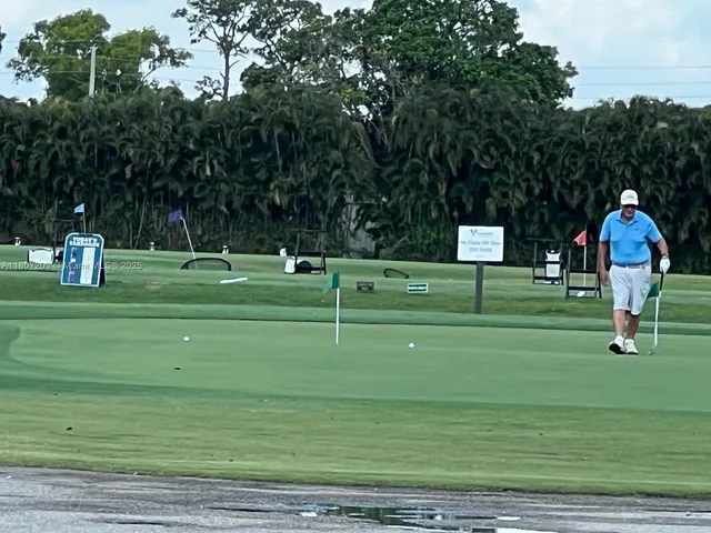 a childrens park with lots of trees and houses