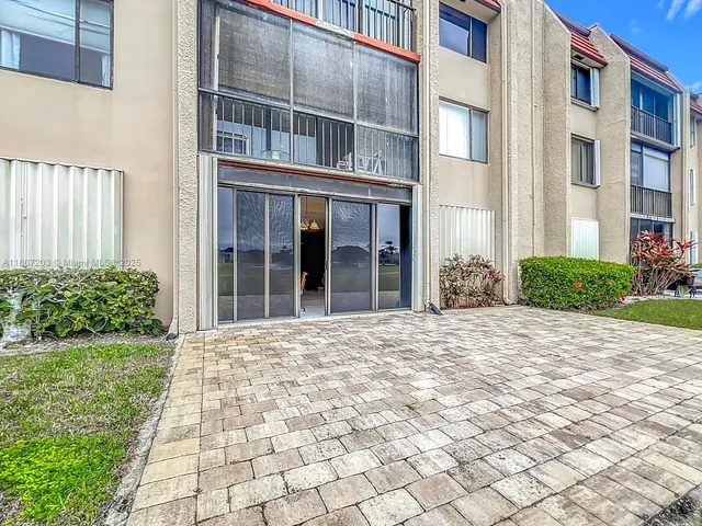 a view of a building with a yard