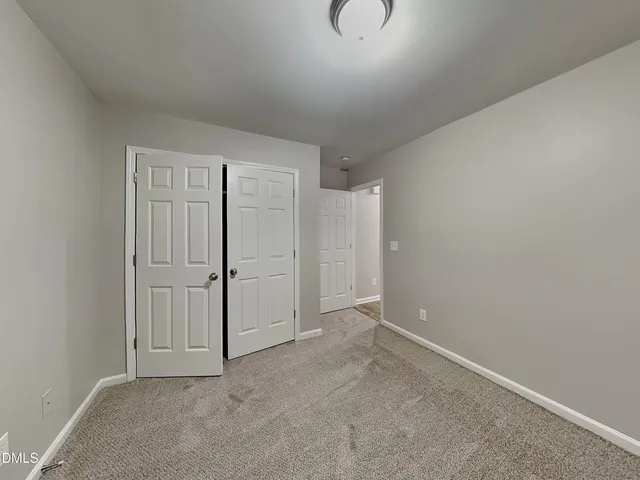 a white toilet sitting next to a bath tub
