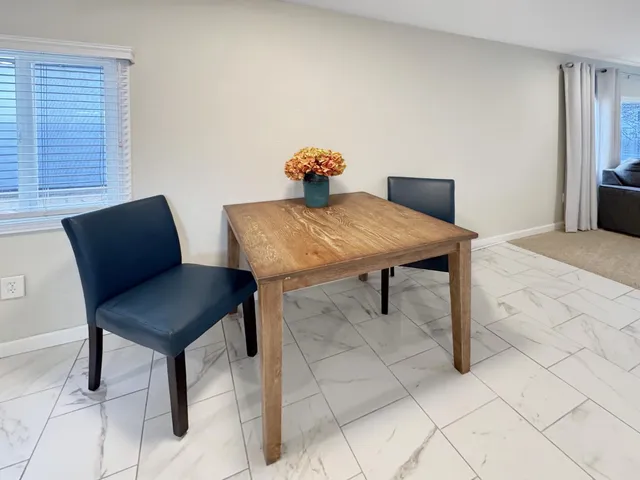 a bedroom with a bed and a chair