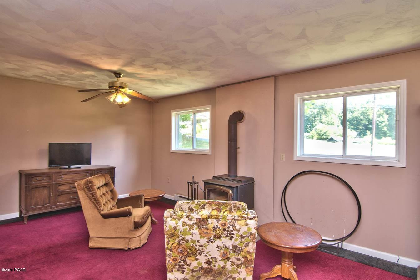 5690 Haas Pond Road Moscow, PA 18444 - Photo 32 of 79 a view of a livingroom with furniture and a workspace