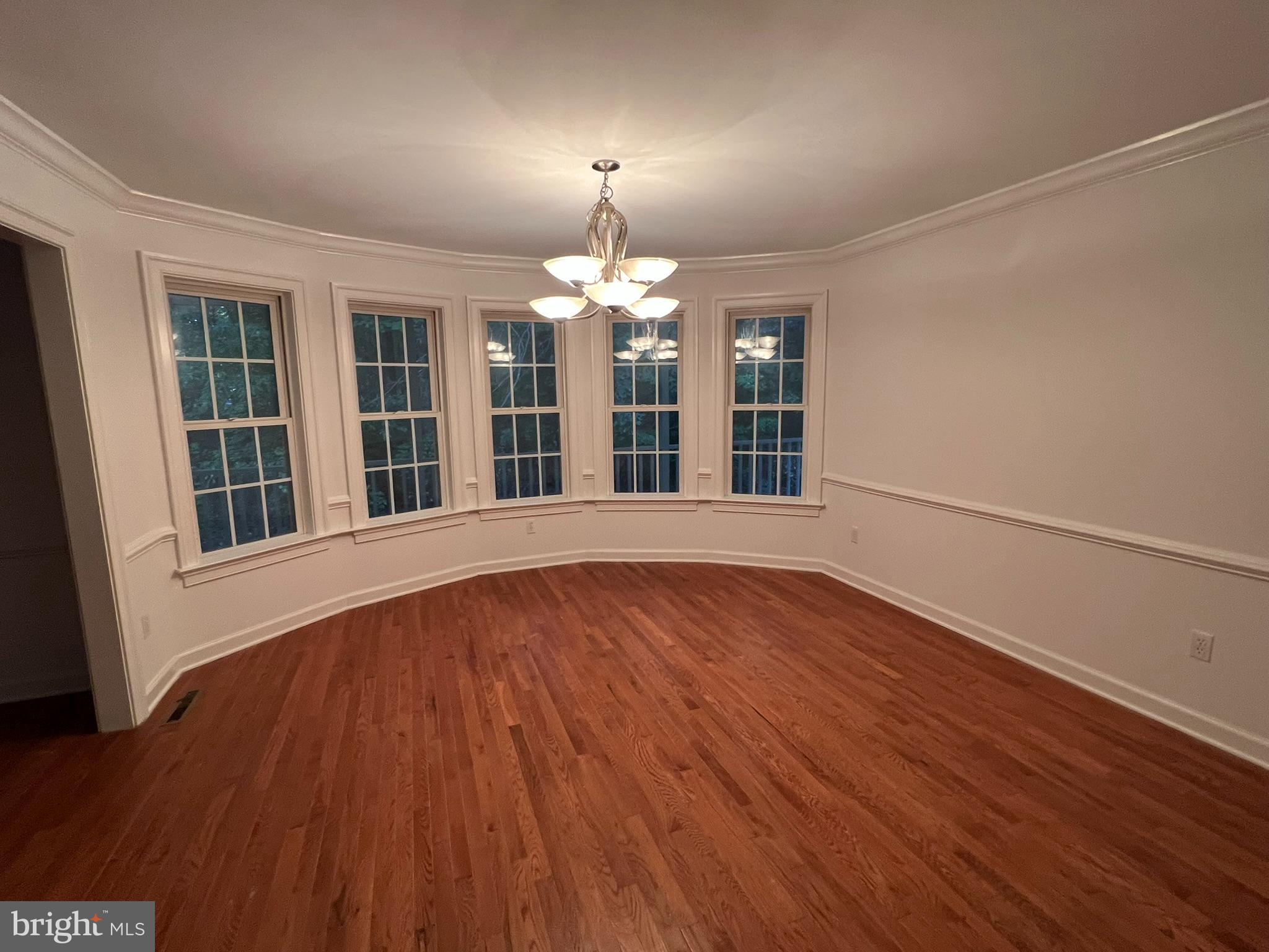 1290 College Road Dover, DE 19904 - Photo 15 of 33 wooden floor in an empty room with a window