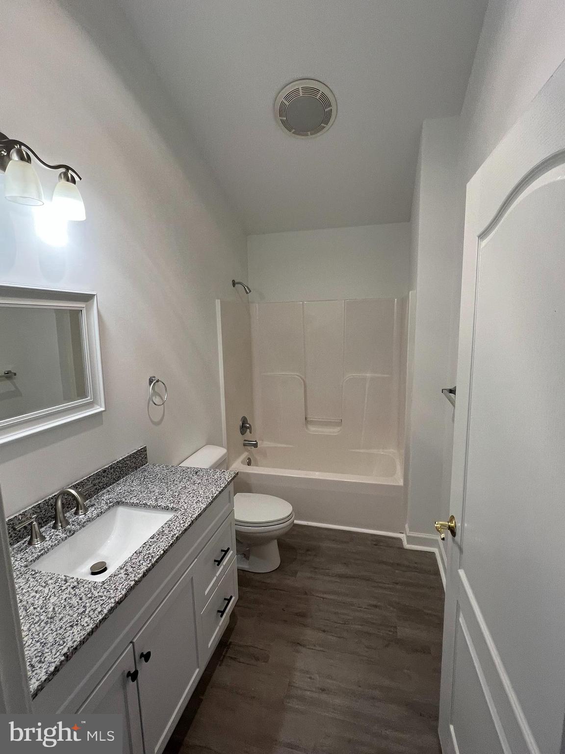 1290 College Road Dover, DE 19904 - Photo 21 of 33 a bathroom with a granite countertop sink toilet and shower