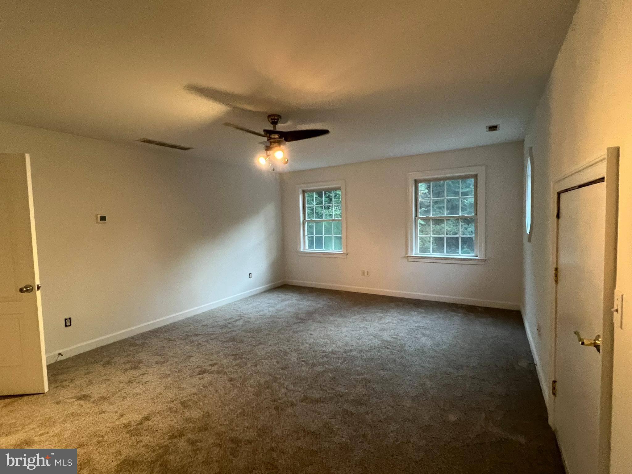 1290 College Road Dover, DE 19904 - Photo 29 of 33 an empty room with windows and closet