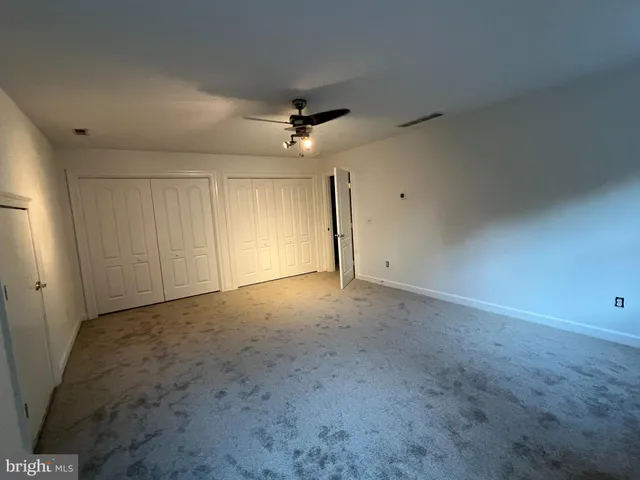 an empty room with a empty space and a window