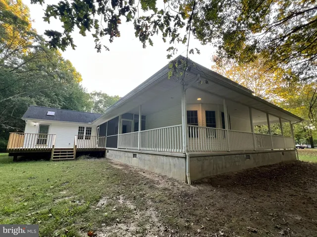 a house with trees in the background