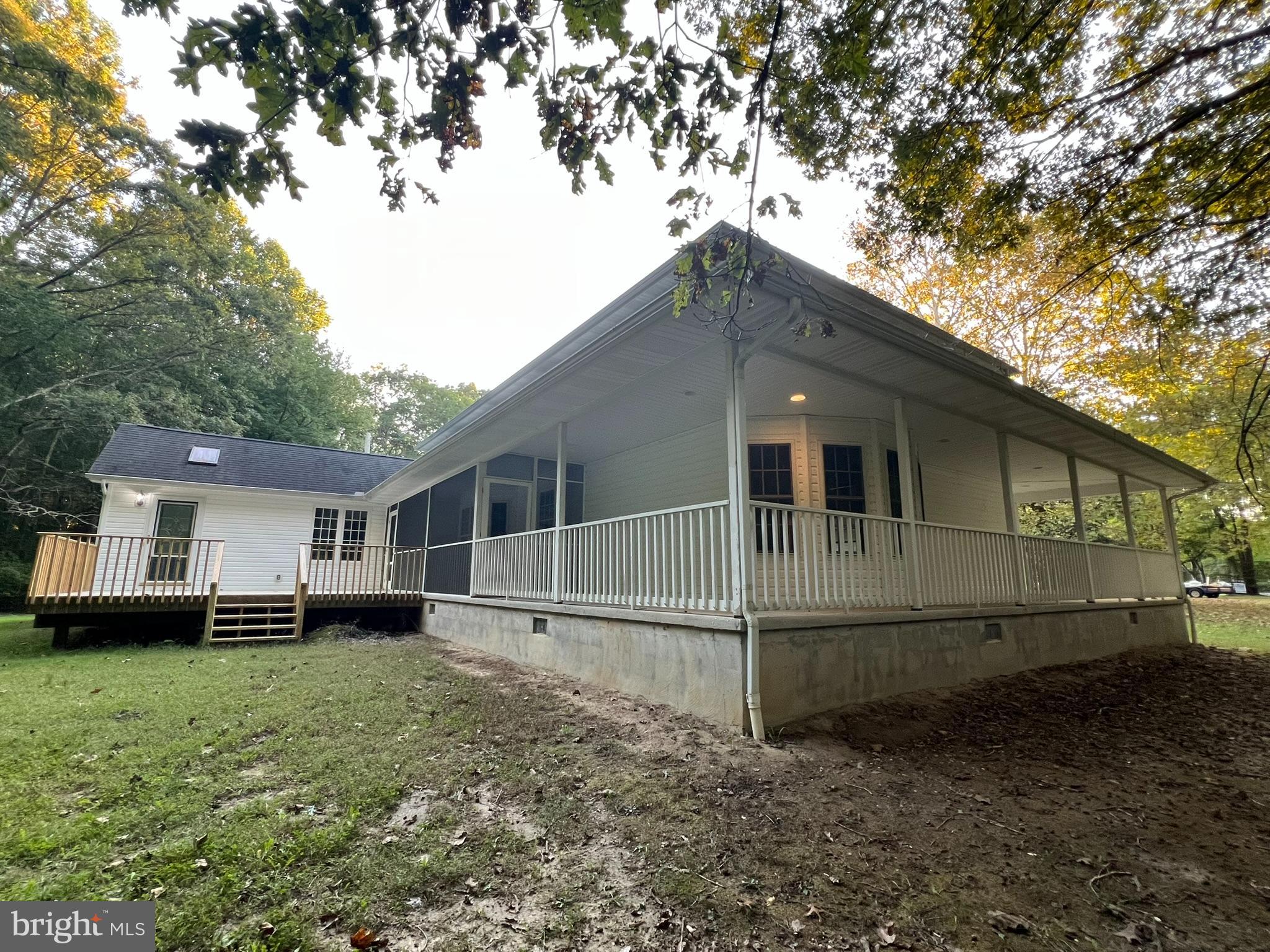 1290 College Road Dover, DE 19904 - Photo 7 of 33 a house with trees in the background