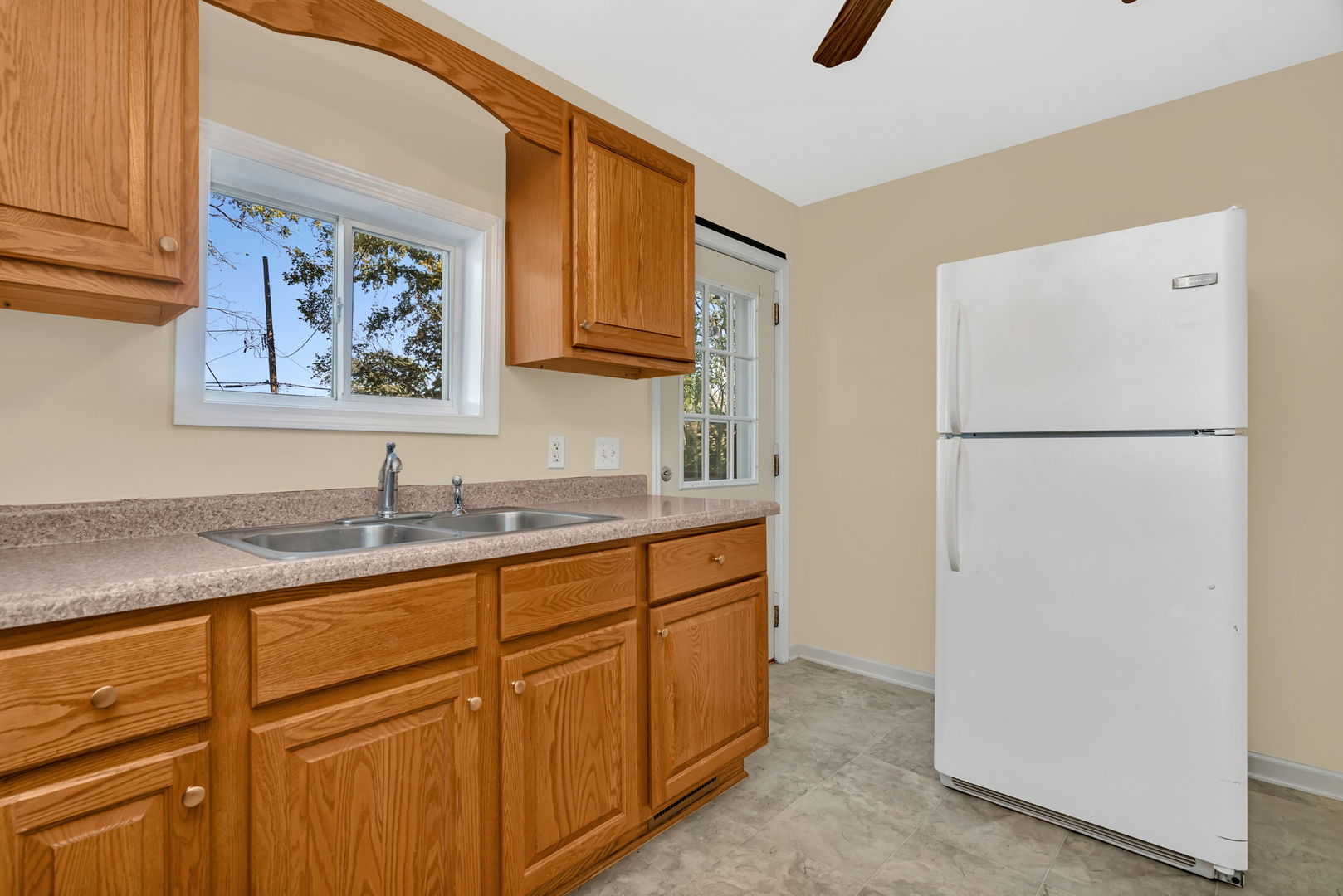212 East Chippewa Street Dwight, IL 60420 - Photo 15 of 32 a kitchen with sink refrigerator and cabinets