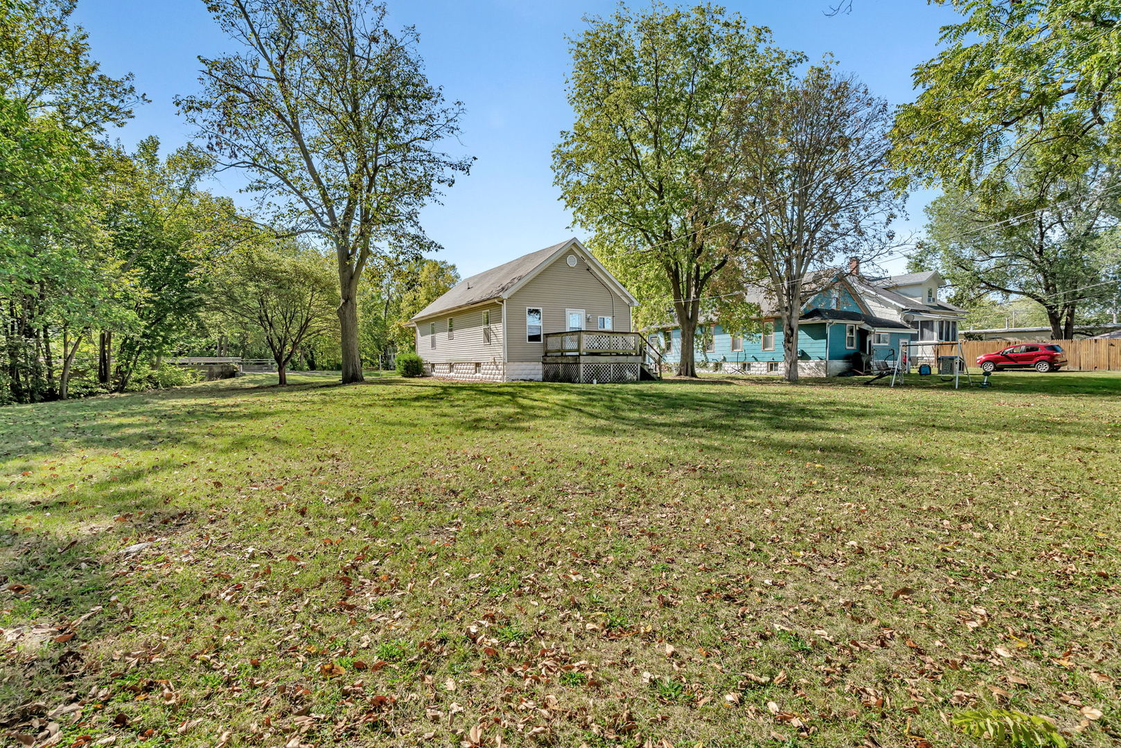 212 East Chippewa Street Dwight, IL 60420 - Photo 24 of 32 a view of a house with a big yard and large trees