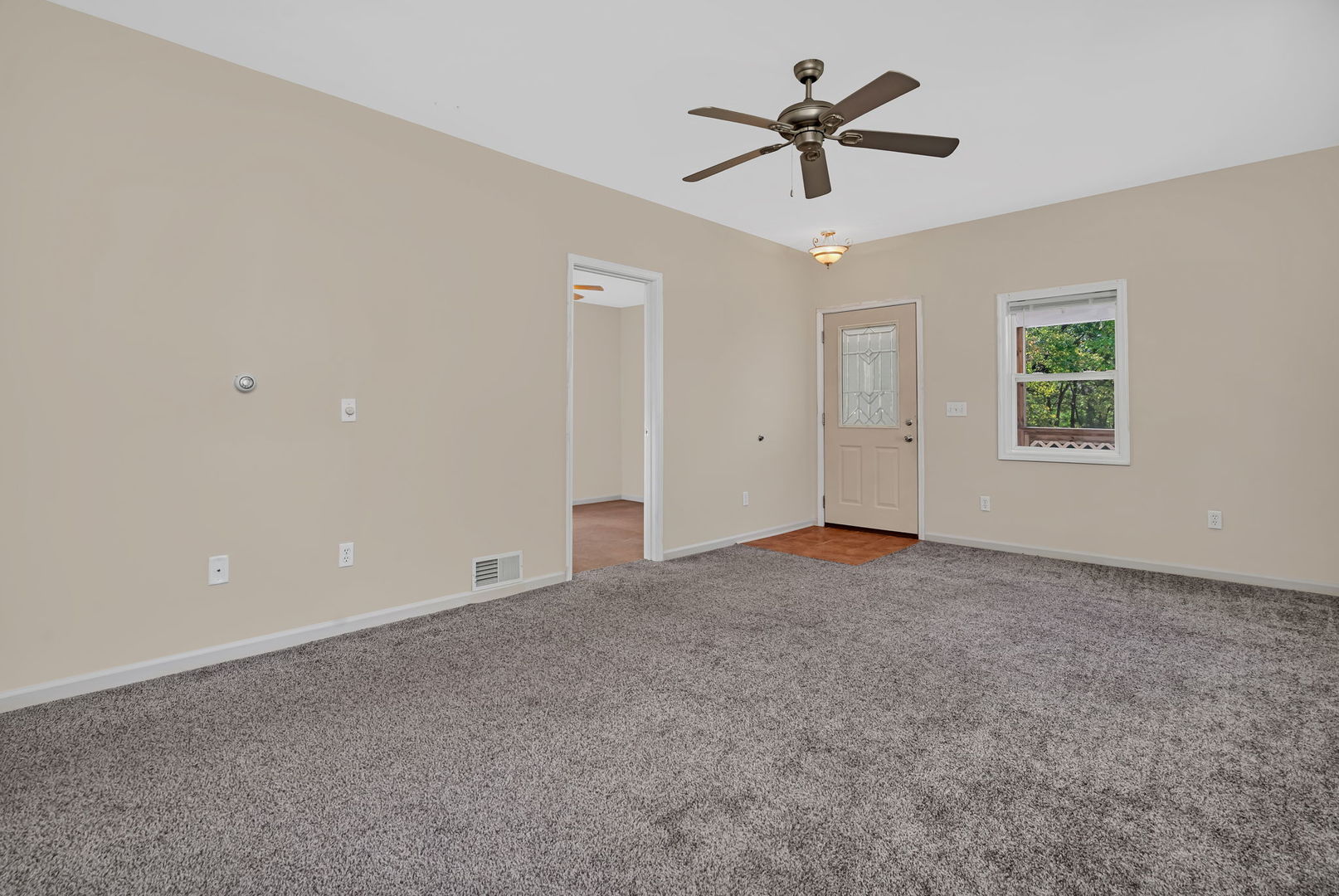 212 East Chippewa Street Dwight, IL 60420 - Photo 4 of 32 a view of an empty room with a window