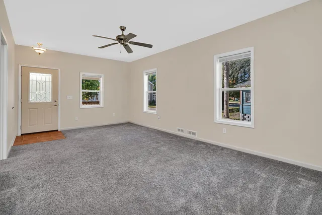 a view of an empty room with a window