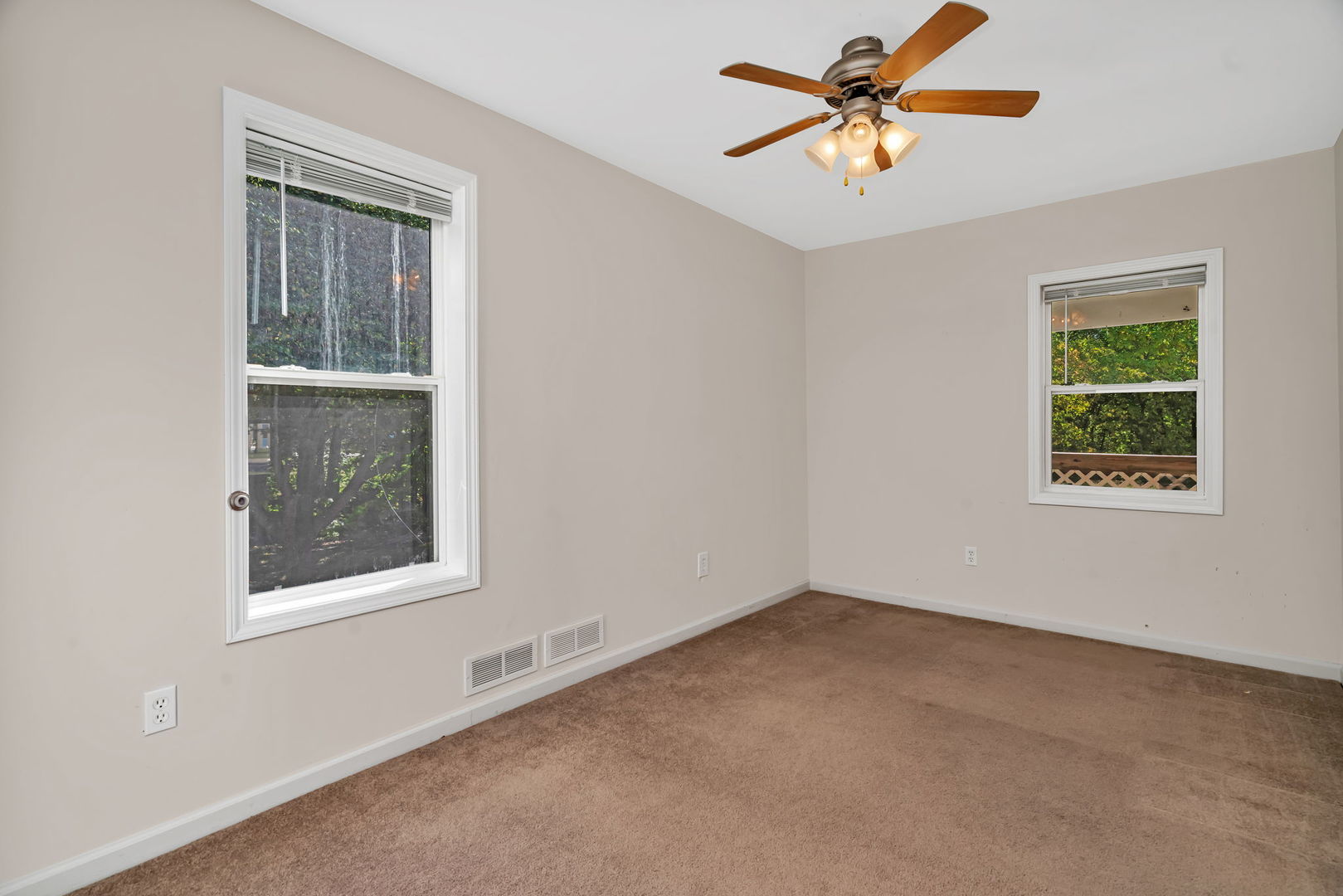 212 East Chippewa Street Dwight, IL 60420 - Photo 7 of 32 an empty room with a window and a fan