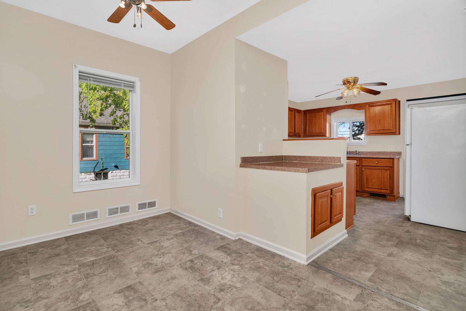 212 East Chippewa Street Dwight, IL 60420 - Photo 10 of 32 a view of a kitchen with stainless steel appliances cabinets and a window