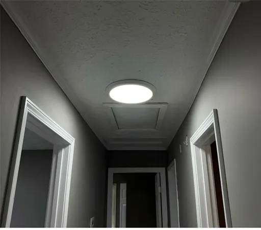 a view of a hallway with a large window