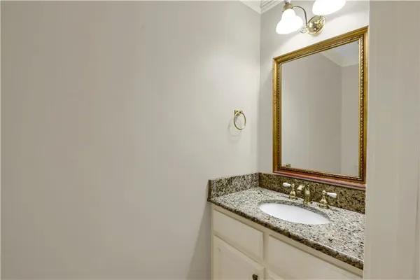 an empty room with windows and ceiling fan