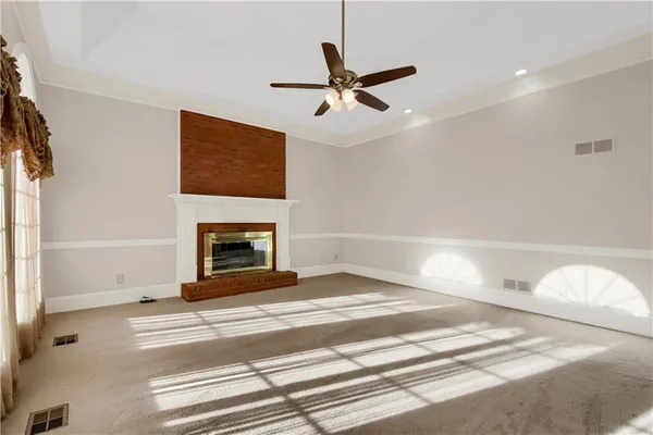 a view of empty room with windows