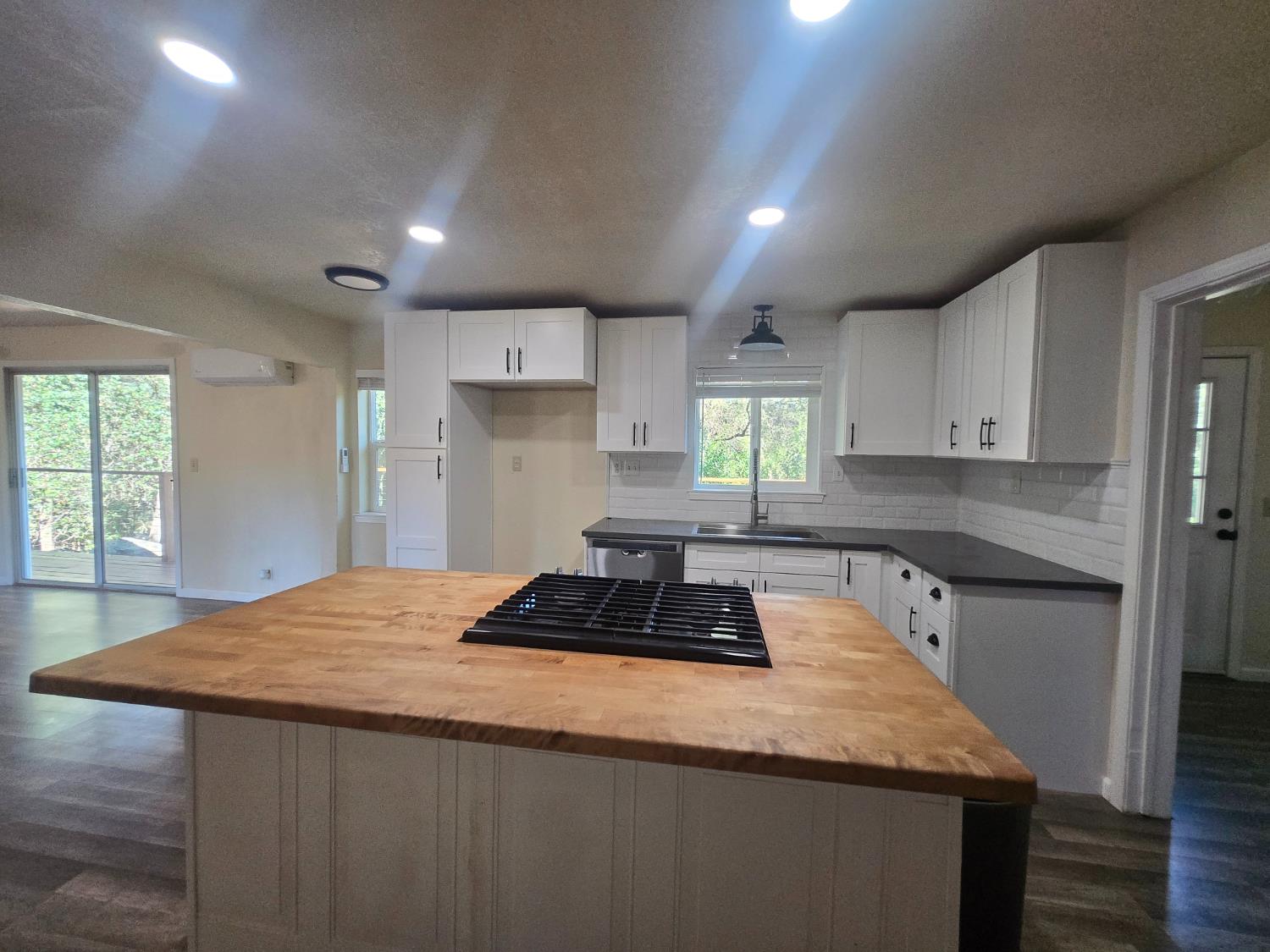 10601 Lime Kiln Road Grass Valley, CA 95949 - Photo 14 of 79 Butcher block island with gas stove. Room for a few chairs so you can visit while preparing meals.