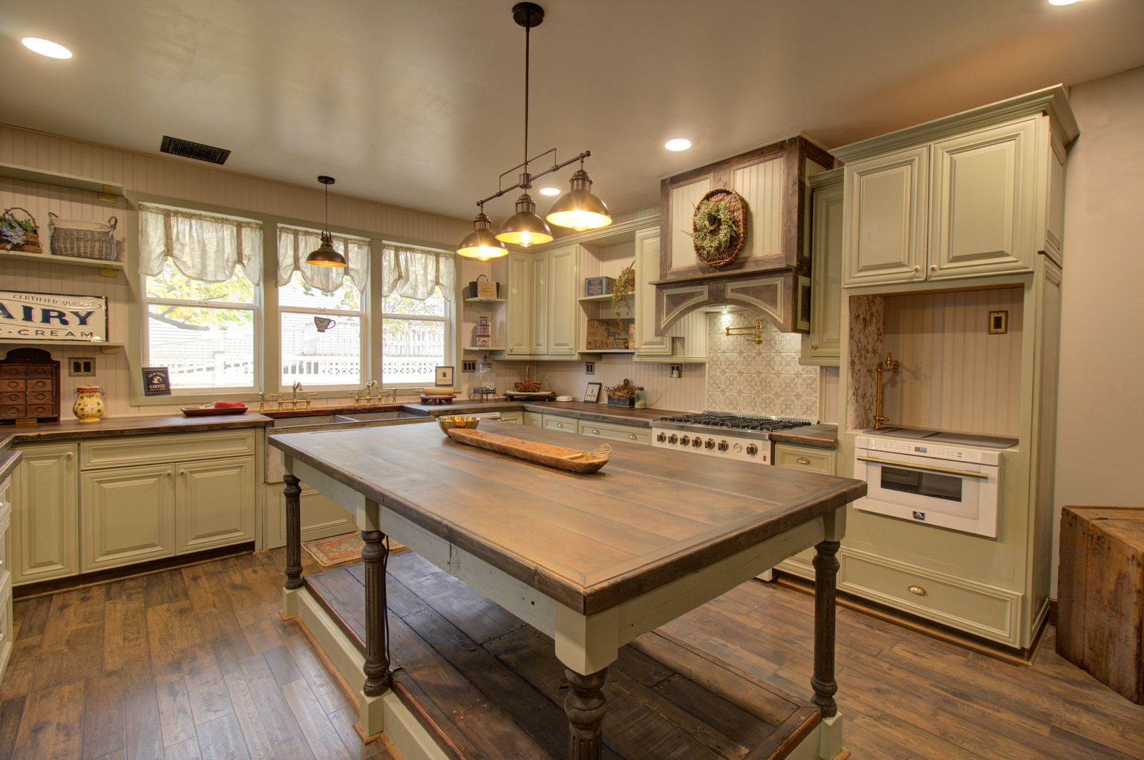 402 West Lincoln Way Morrison, IL 61270 - Photo 17 of 43 a kitchen with sink cabinets and wooden floor
