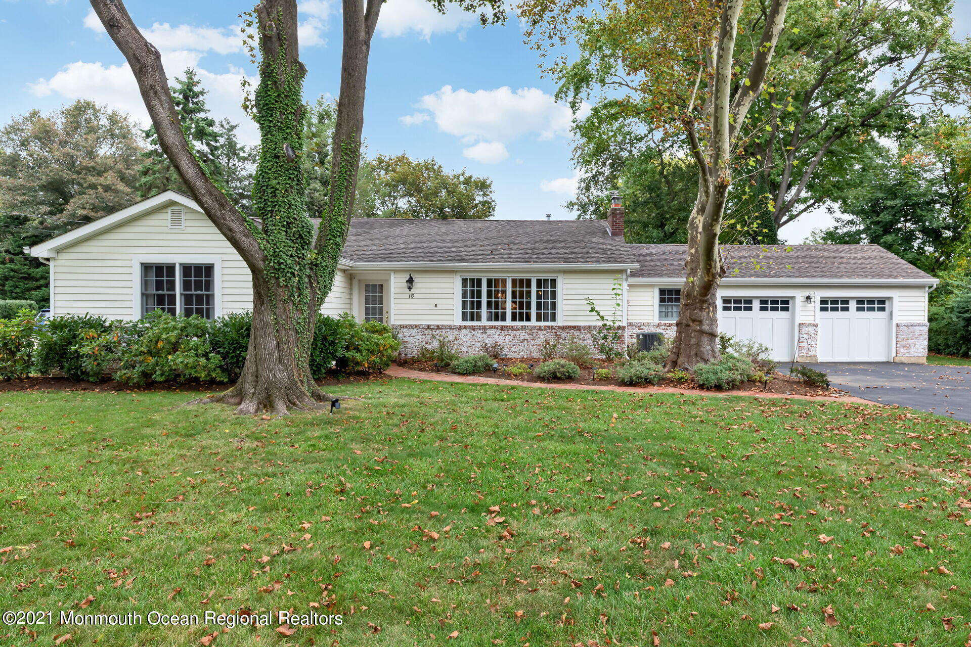 16 Westwood Road Little Silver, NJ 07739 - Photo 2 of 39 a front view of a house with a yard and trees