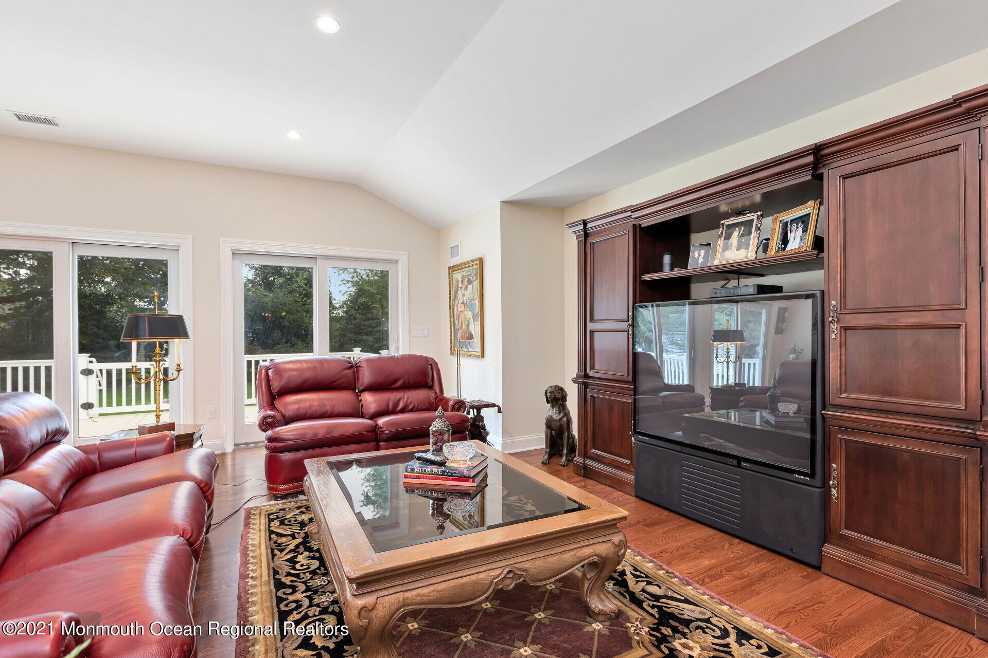 16 Westwood Road Little Silver, NJ 07739 - Photo 16 of 39 a living room with furniture fireplace and flat screen tv