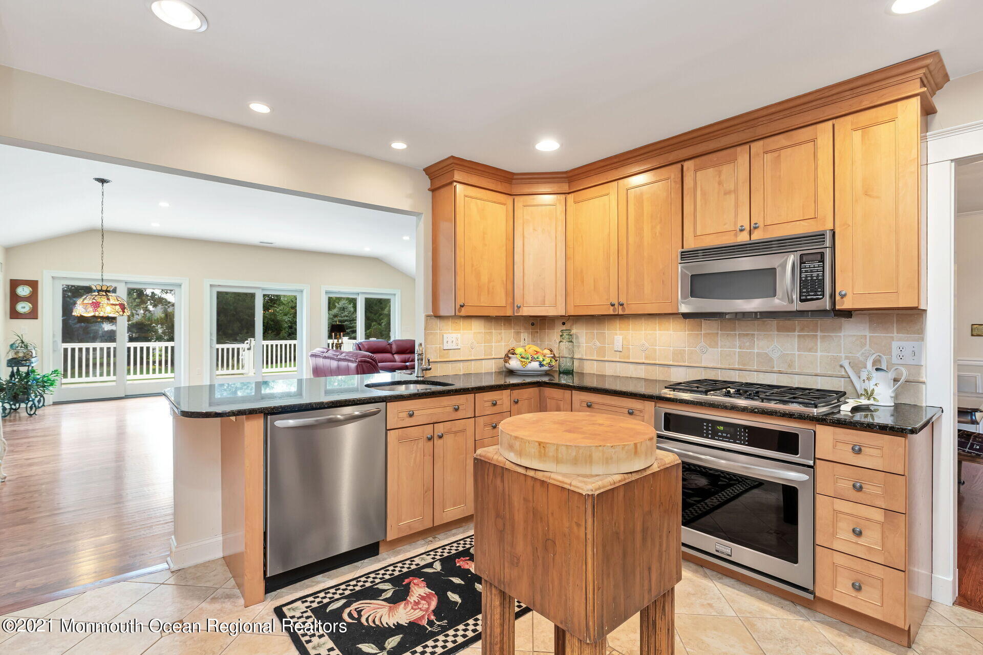 16 Westwood Road Little Silver, NJ 07739 - Photo 21 of 39 a kitchen with stainless steel appliances granite countertop a stove a sink and a microwave