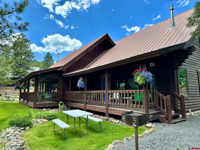 a view of porch with a yard