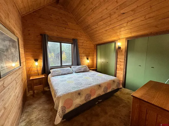 a bedroom with a bed and furniture