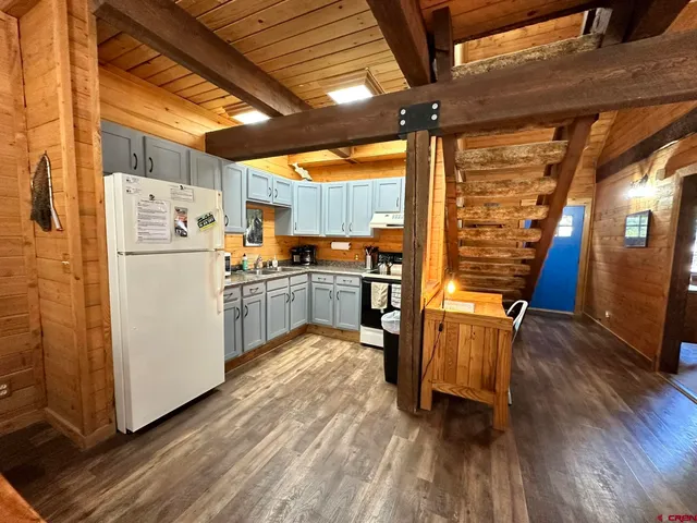 a kitchen with a sink cabinets and stainless steel appliances