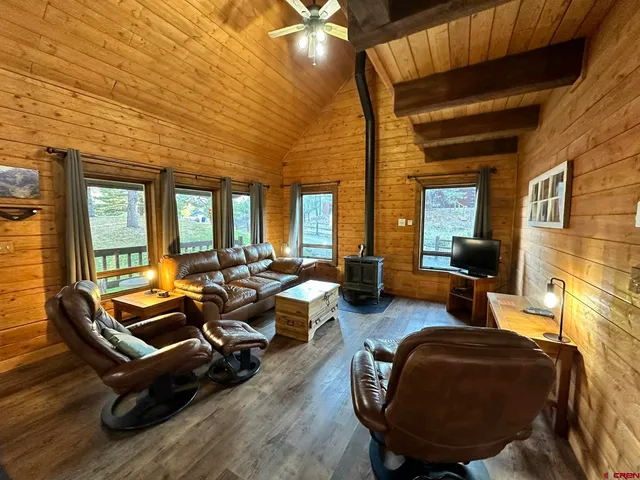 a room with furniture and a large window