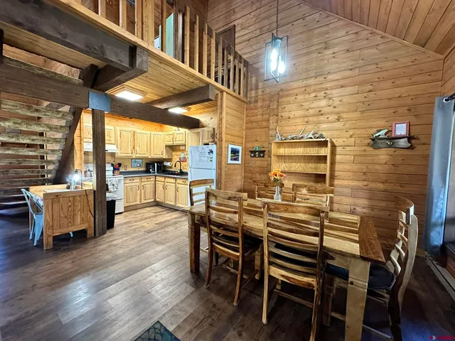 a kitchen with stainless steel appliances granite countertop a stove sink and cabinets