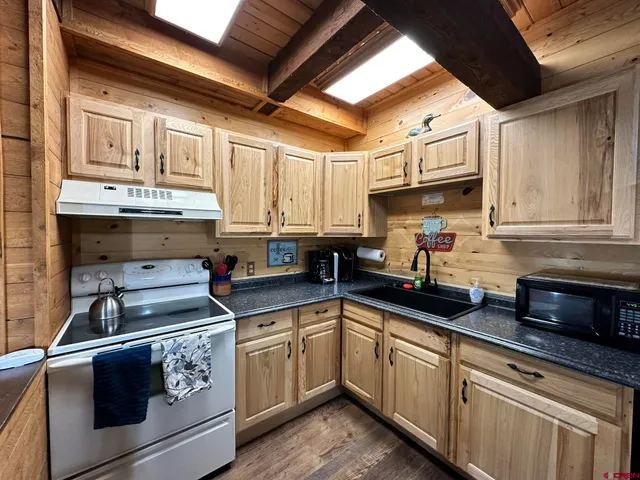a bedroom with a large bed and a large window