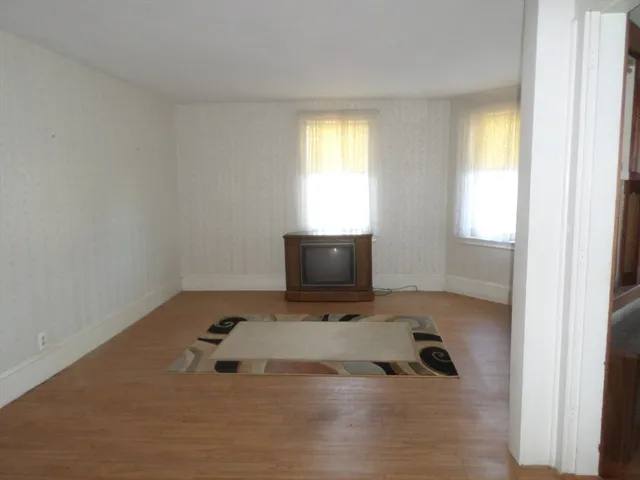 a room with a bed and a window