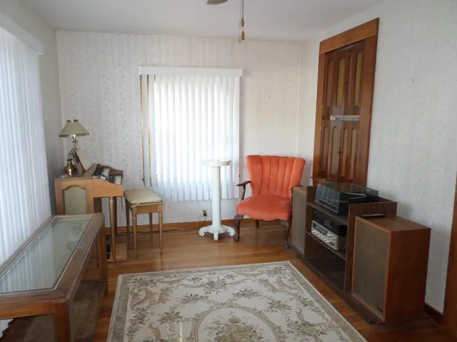 a living room with furniture and a rug