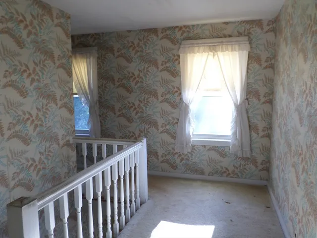 a view of a room that has a window in it