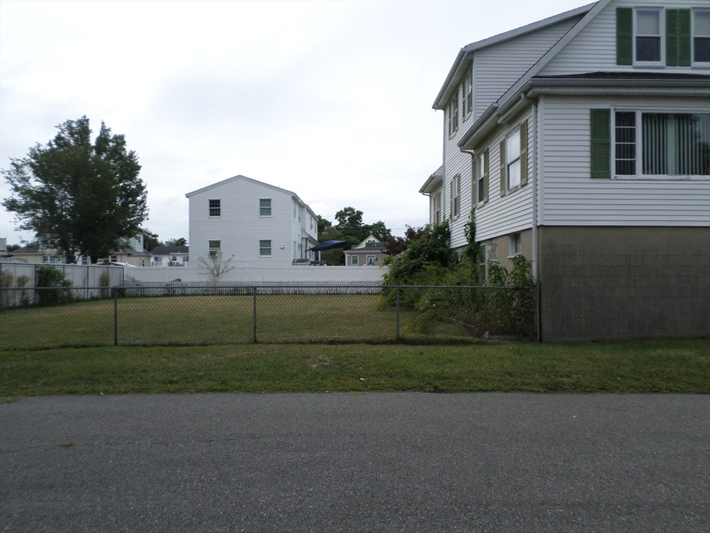9 Douglas Road Saugus, MA 01906 - Photo 5 of 31 a front view of a house with a yard