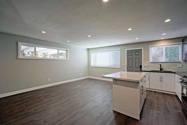 a kitchen with sink and window