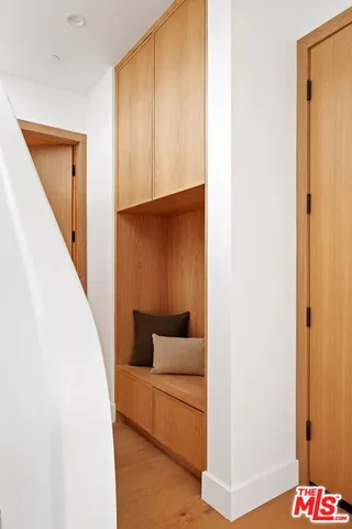 a view of a living room with furniture and a large window