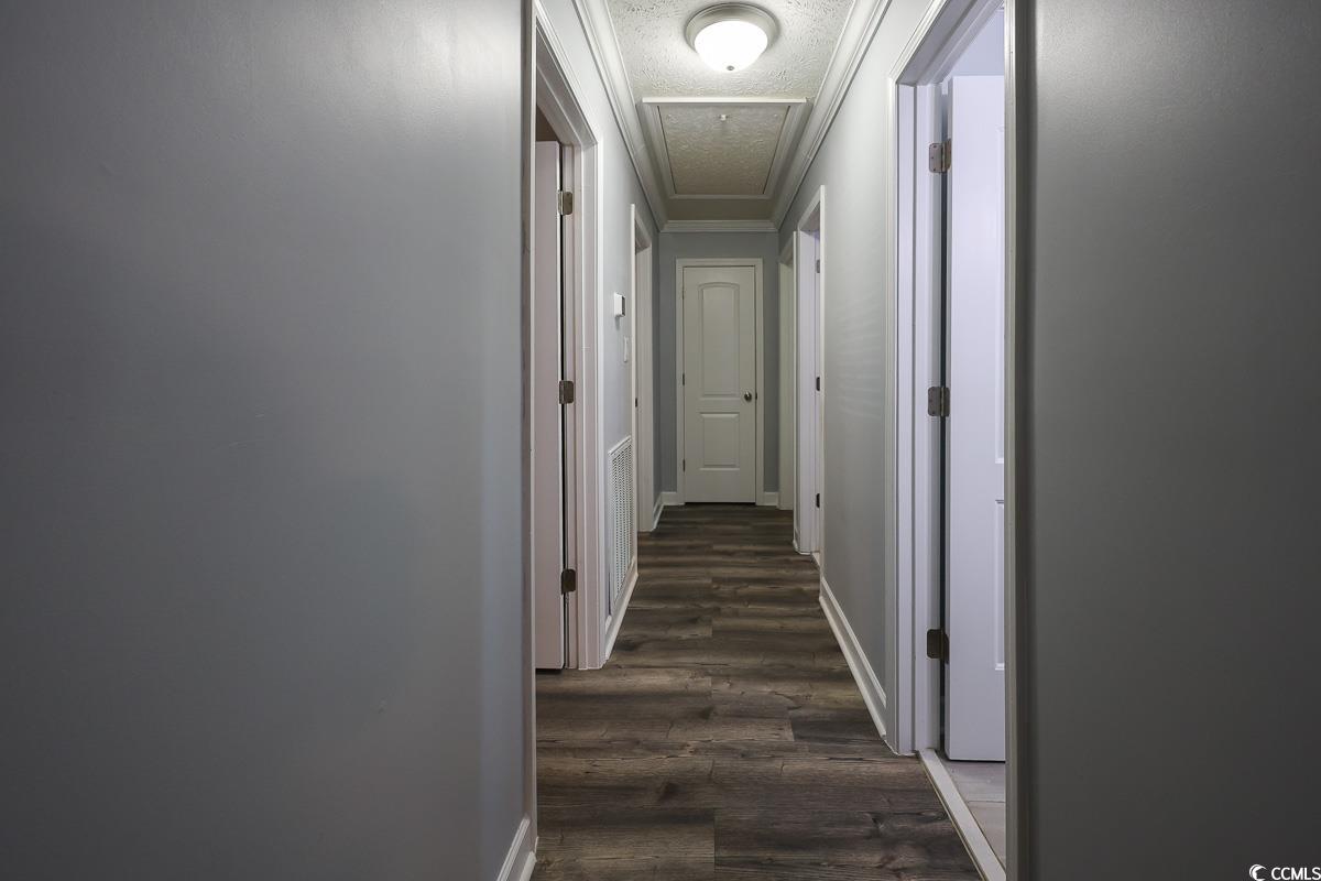1704 Sherwood Drive Conway, SC 29526 - Photo 24 of 32 Hallway with a textured ceiling and dark wood finished floors