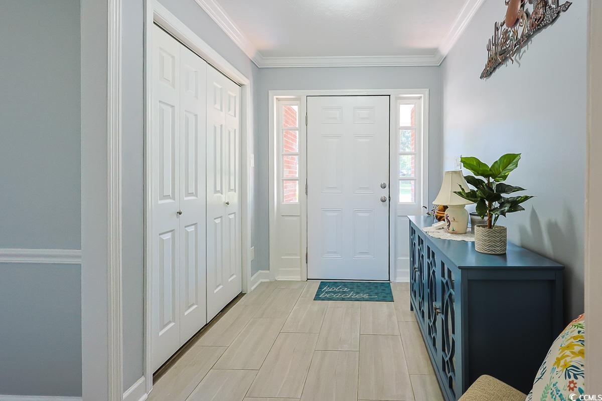 1704 Sherwood Drive Conway, SC 29526 - Photo 7 of 32 Entrance foyer featuring ornamental molding and wood finish floors