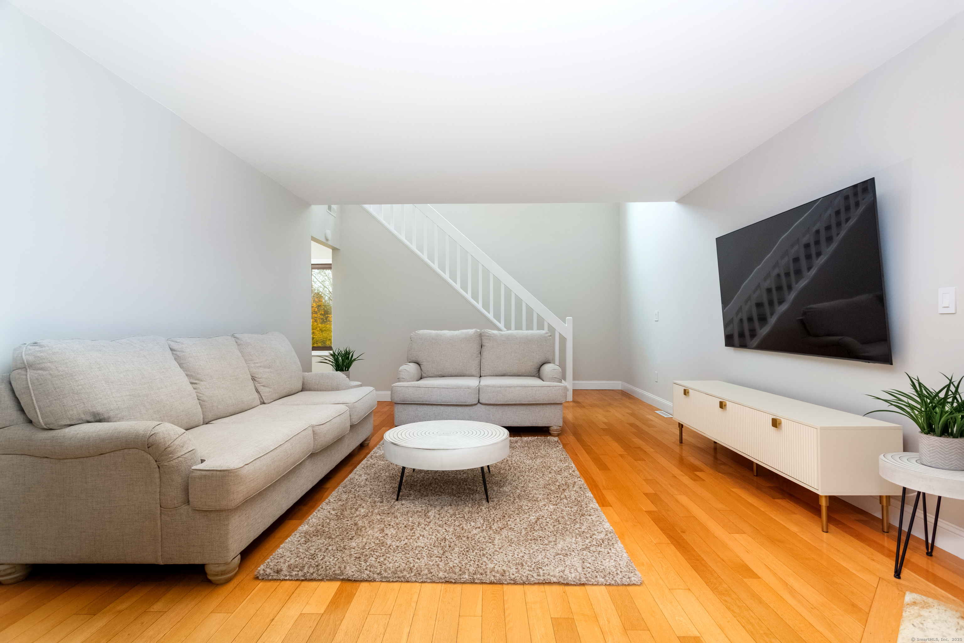 4 Pond View Drive, Unit 4 Brookfield, CT 06804 - Photo 11 of 38 a living room with furniture and a flat screen tv