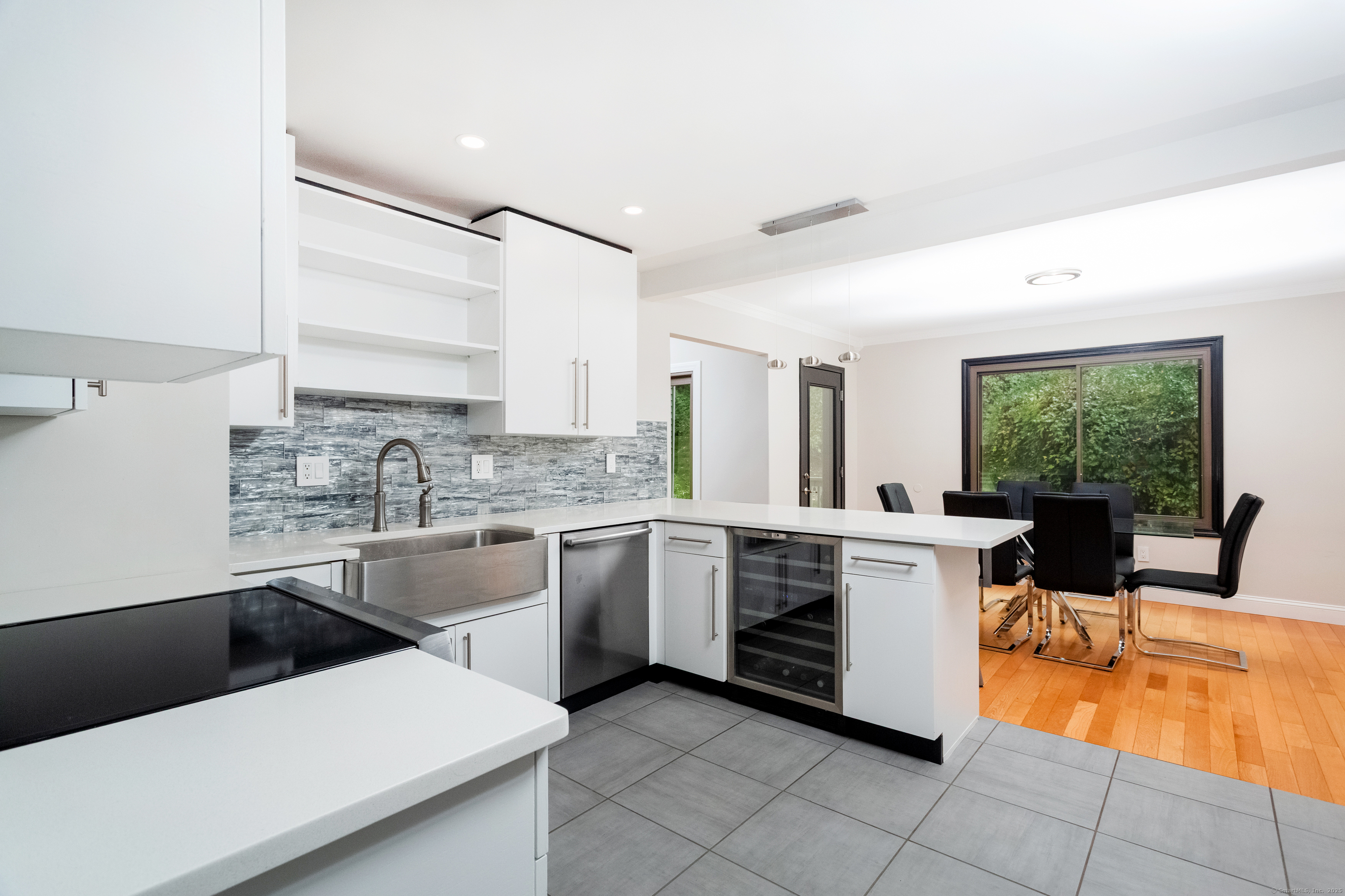 4 Pond View Drive, Unit 4 Brookfield, CT 06804 - Photo 16 of 38 a kitchen with stainless steel appliances kitchen island granite countertop a sink and white cabinets