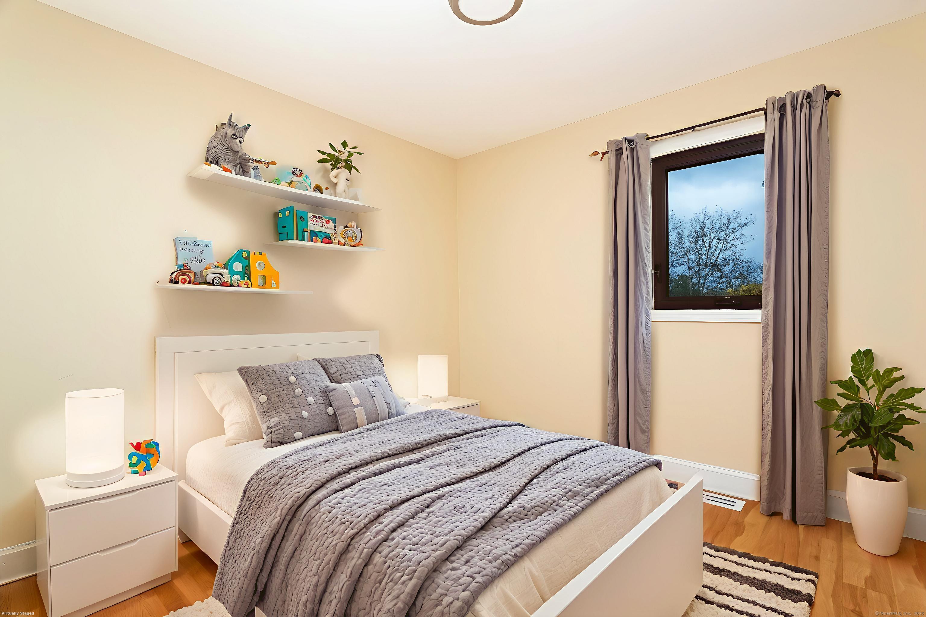 4 Pond View Drive, Unit 4 Brookfield, CT 06804 - Photo 21 of 38 a bedroom with a bed and a potted plant