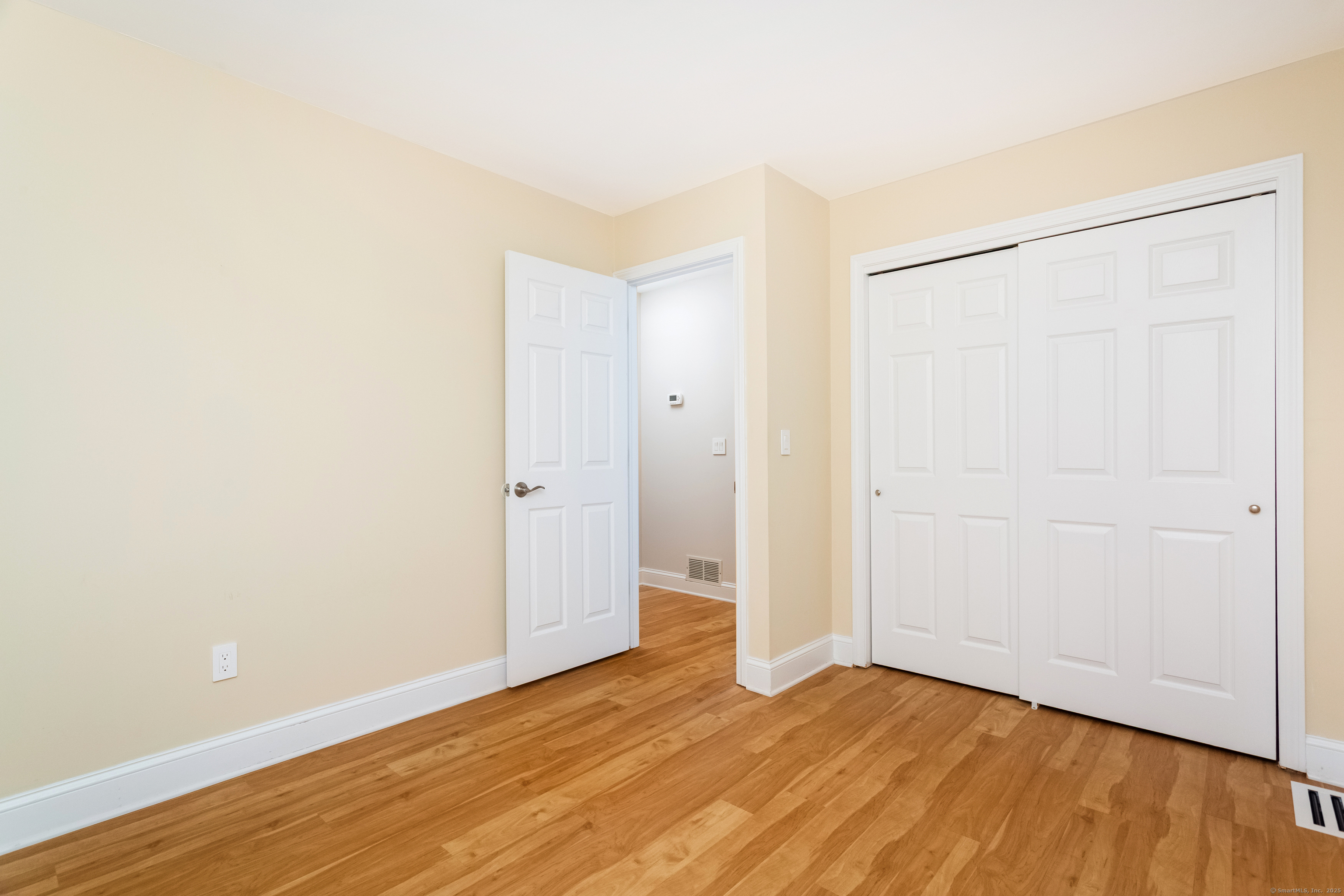 4 Pond View Drive, Unit 4 Brookfield, CT 06804 - Photo 22 of 38 a view of an empty room with wooden floor