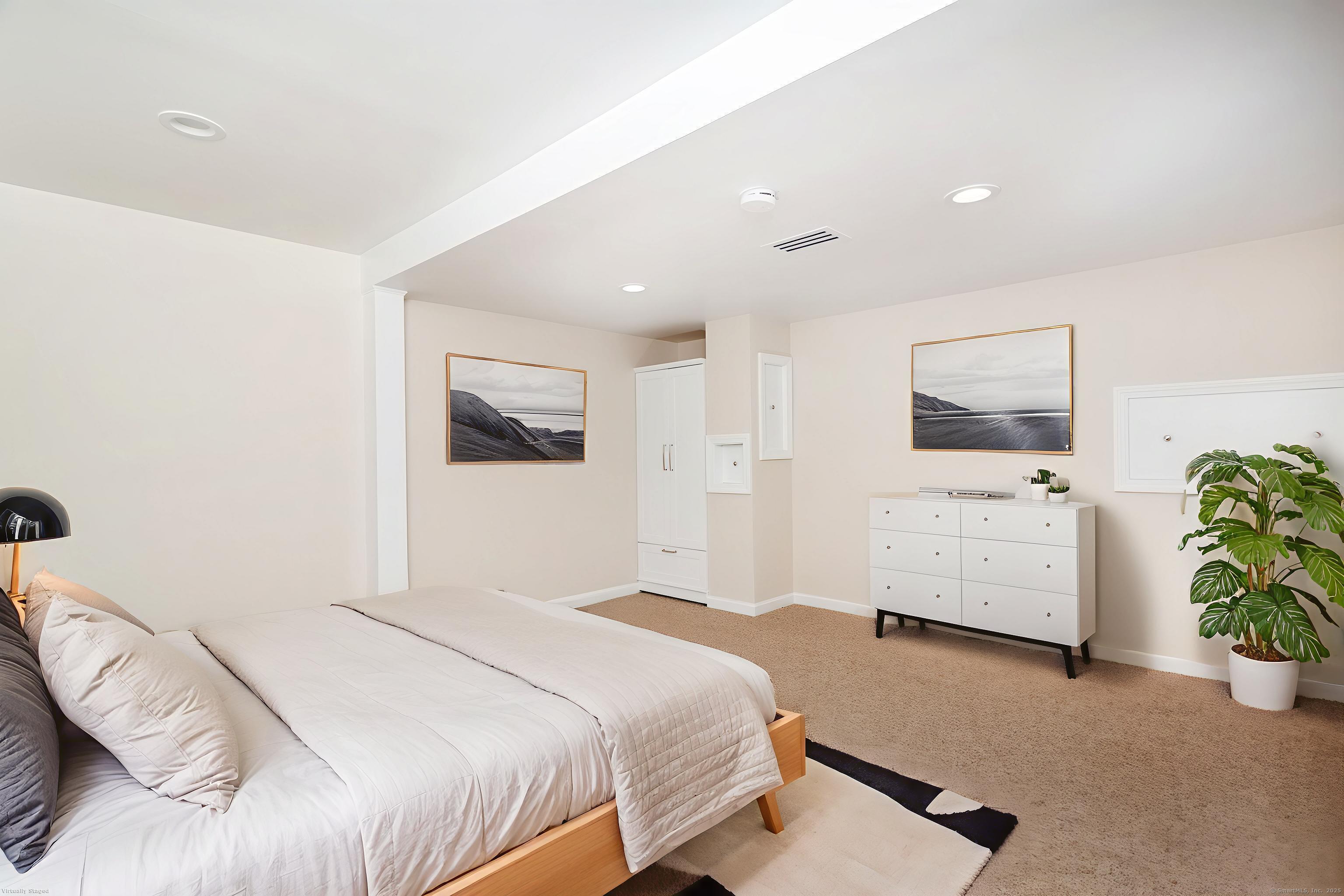 4 Pond View Drive, Unit 4 Brookfield, CT 06804 - Photo 6 of 38 a bedroom with a bed and a couch