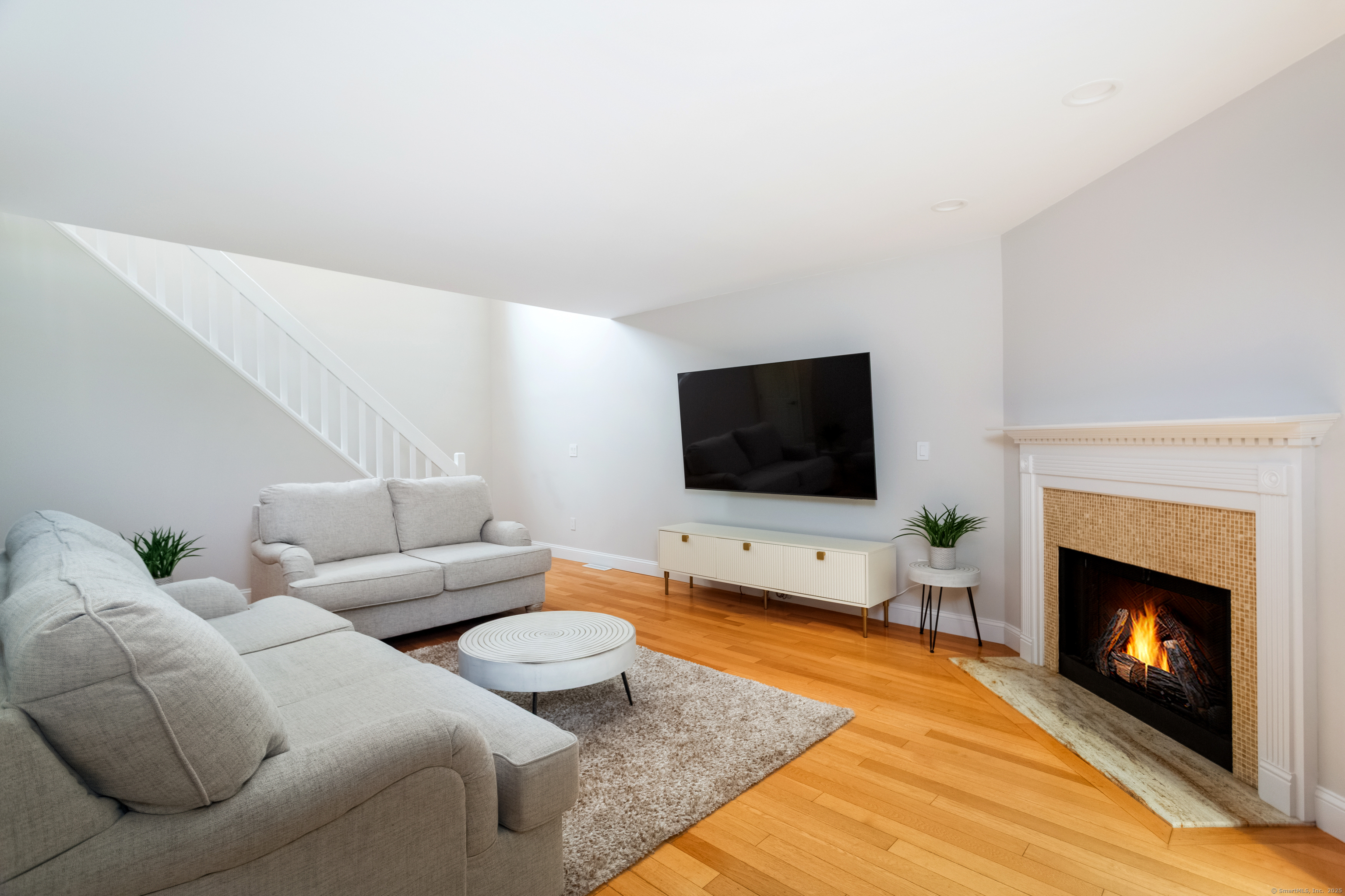 4 Pond View Drive, Unit 4 Brookfield, CT 06804 - Photo 9 of 38 a living room with furniture and a flat screen tv