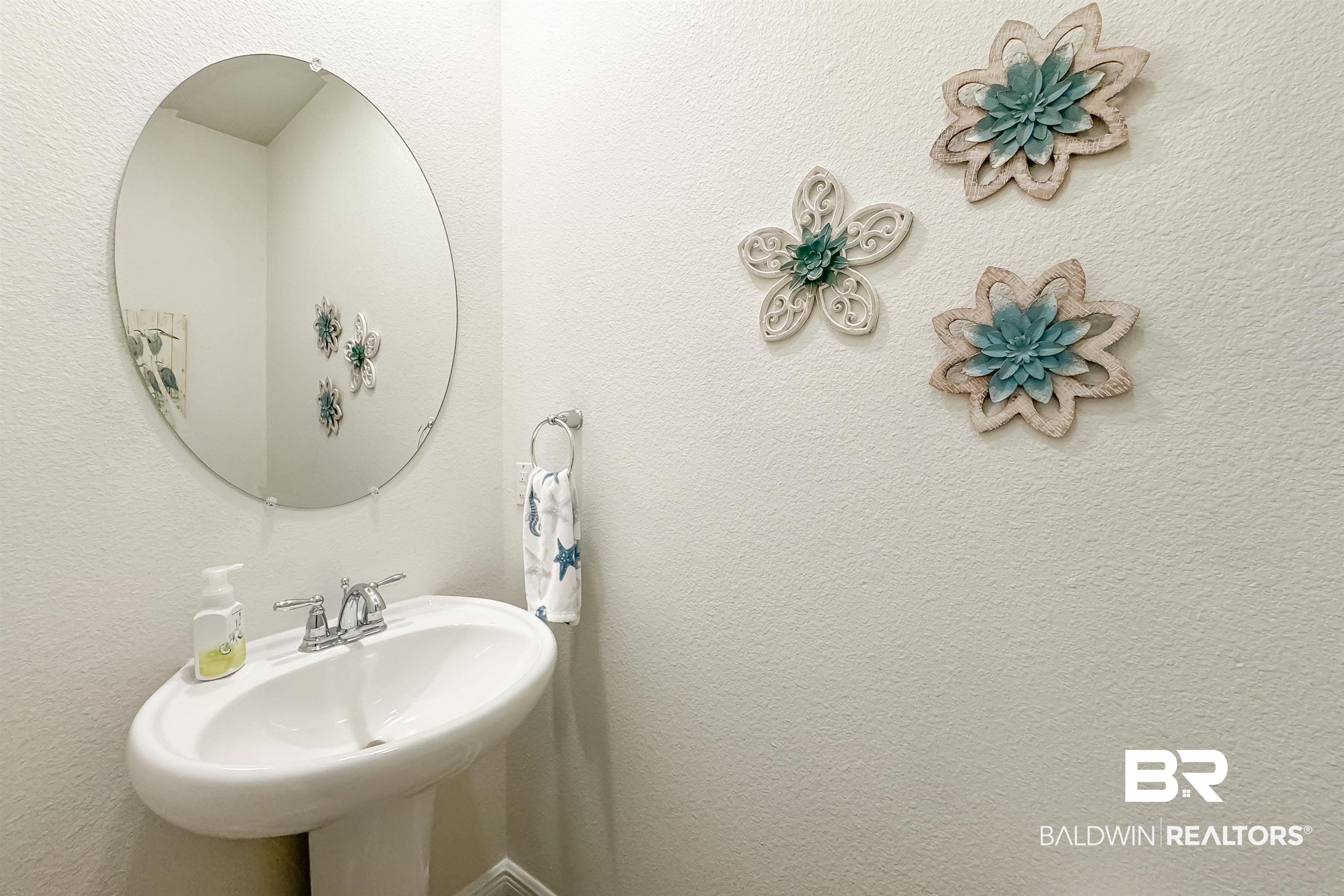 1290 Mako Loop Gulf Shores, AL 36542 - Photo 15 of 50 Bathroom featuring a textured wall and a sink