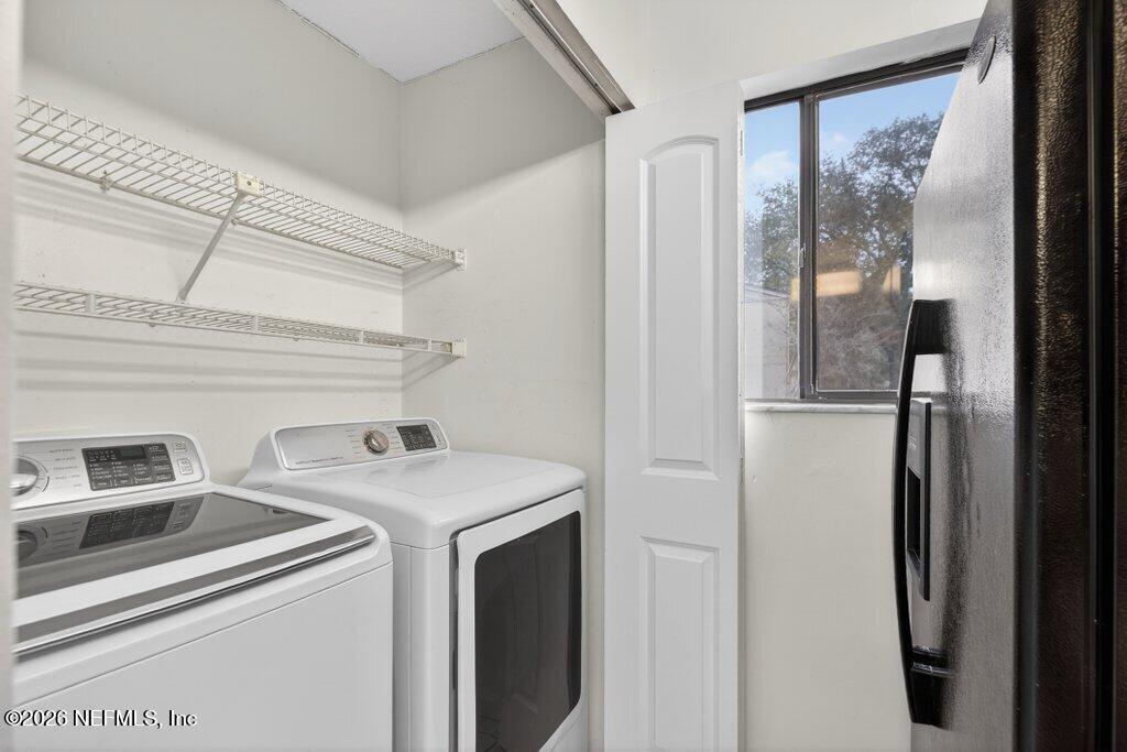 3801 Crown Point Road, Unit 2072 Jacksonville, FL 32257 - Photo 13 of 38 a utility room with dryer and washer